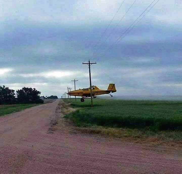 Attached picture crop dusting in the back 40 002(1).jpg